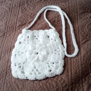 Small child crochet white crossbody bag.